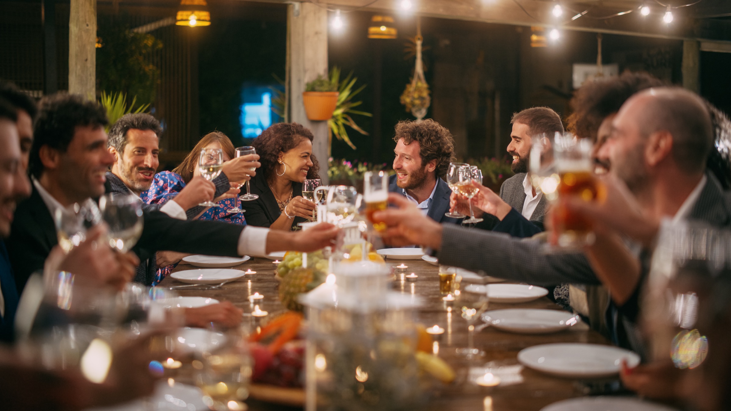 Guests gathered around the wedding reception table